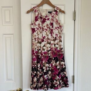 Nice bright summer dress. There is a small spot. Haven’t tried getting it out.